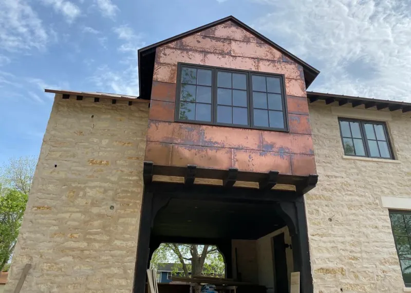 Copper metal panel facade on a stone building for Skylight Installation in Aliso Viejo